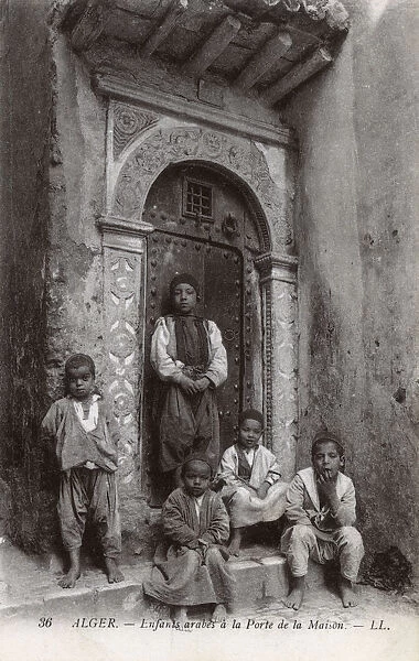 Arab children in a house doorway, Algiers, Algeria