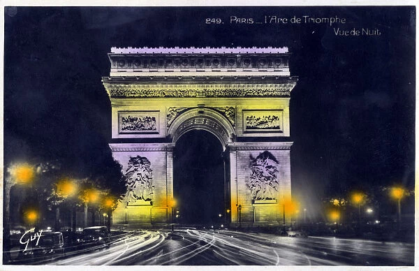 The Arc de Triomphe, Paris, France - photographed at night. Date: circa 1930s