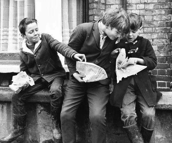 Boys eating fish and chips, Balham, SW London