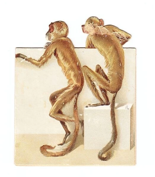 Two monkeys on a cutout New Year card