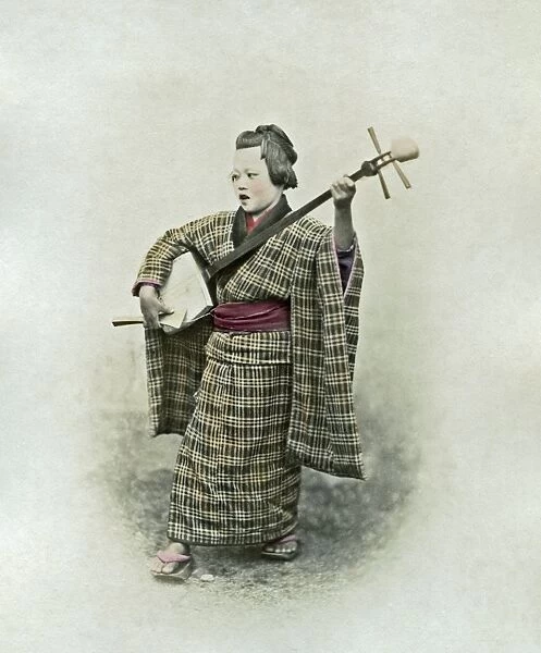 Musician and samisen, Japan