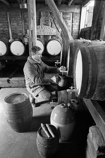 Pouring cider in cider barn at Dunkertons cider, England