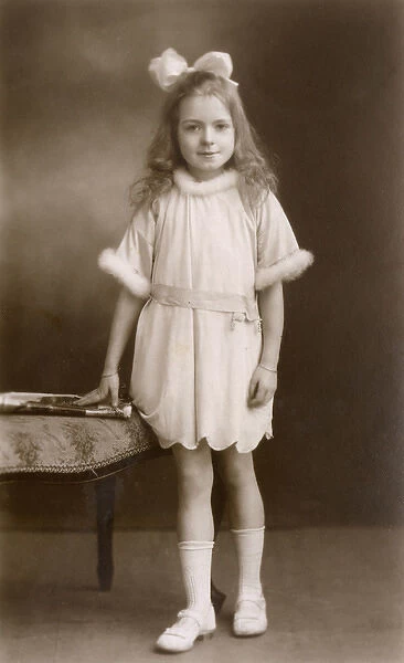 Studio portrait, little girl in party dress
