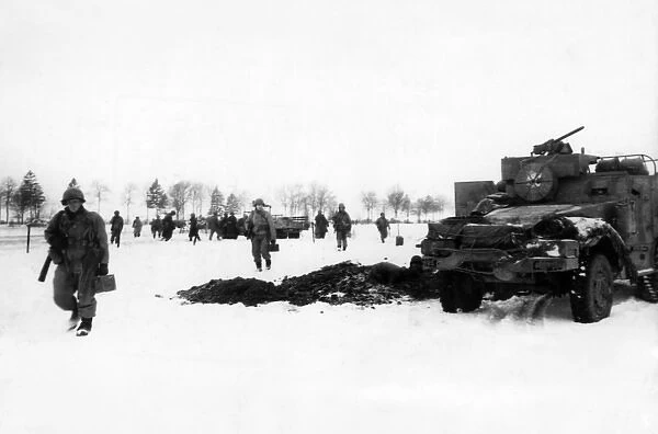 US tanks and infantry on Bastogne front