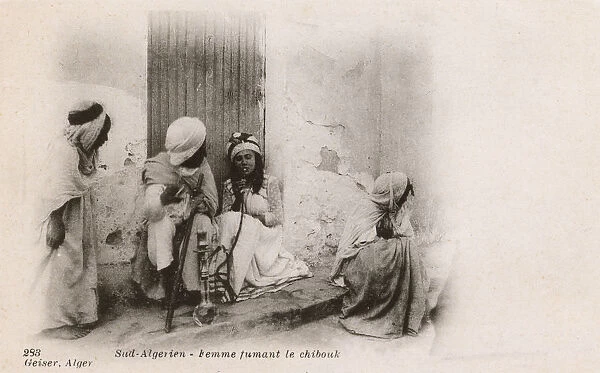 Women smoking a Chibouk Pipe - Southern Algeria