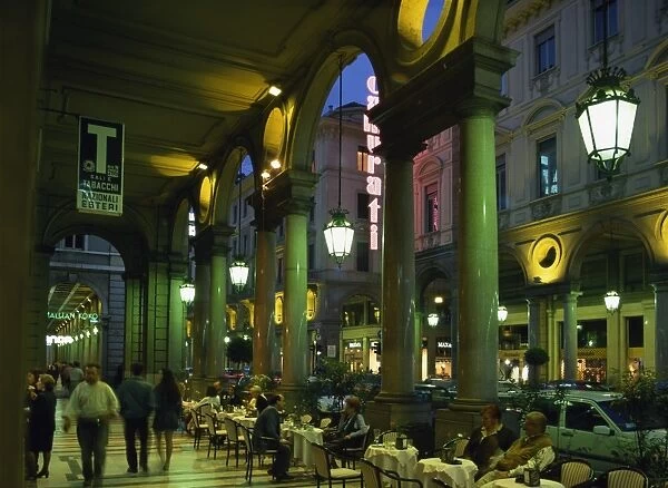 Cafes in the arcade on the Via Roma at night
