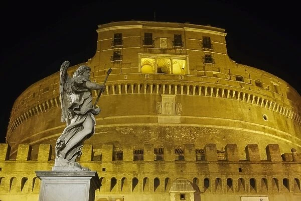 Castel Sant Angelo facade at night with statue on Ponte Sant Angelo, UNESCO World Heritage Site