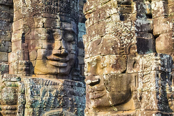 Carved stone faces at Prasat Bayon temple ruins, Angkor Thom, UNESCO World Heritage Site