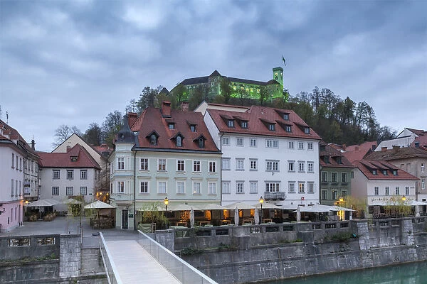 Europe, Slovenia, Ljubljana. Buildings on the Ljubljanica river and the Castle