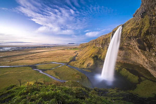 Scenic view of Seljalandsfoss waterfall from hill, South Iceland, Iceland