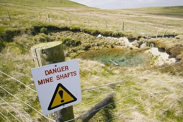 An abandoned mine shaft on the Caldbeck Fells in the Lake District UK