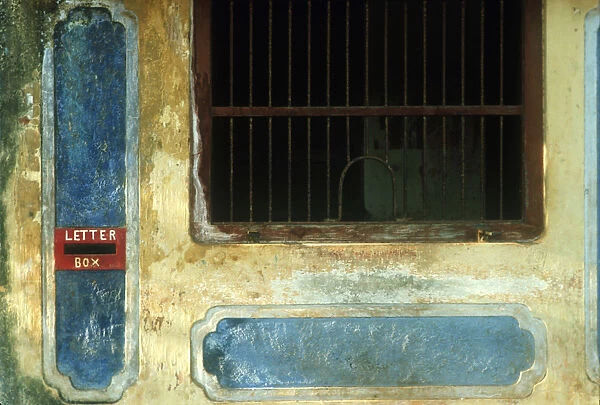 10003056. SRI LANKA Near Jaffna Detail of colourful but weathered post office window