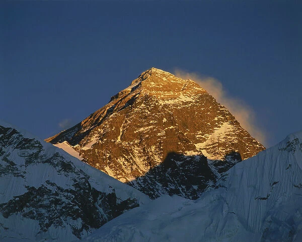 10010390. NEPAL Everest National Park Mount Everest peak bathed in golden evening sunlight