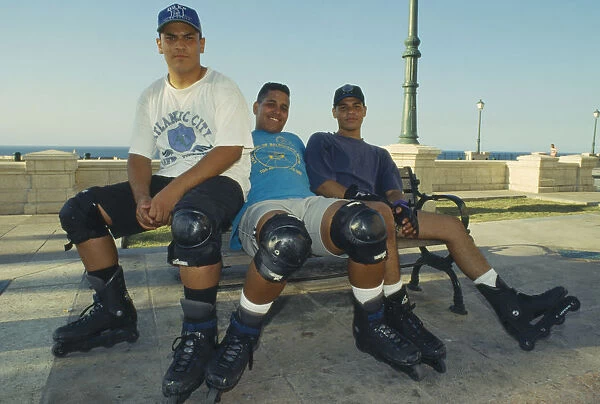 10044399. WEST INDIES Puerto Rico San Juan Three teenage boy rollerbladers