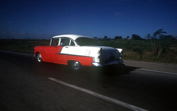 10090294. CUBA Pinar Del Rio Transport Old red and white coloured 1950s US car