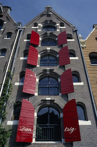 10128838. HOLLAND North Amsterdam Brauwers Gracht. Tall building with red shutters