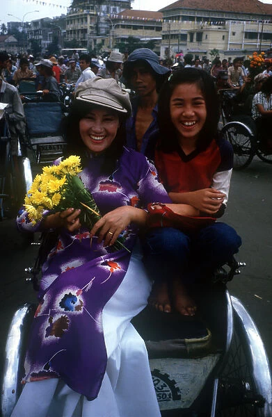 20002335. Vietnam, Ho Chi Minh City, Two young women on a cyclo near central market