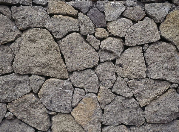 20005679. INDONESIA Bali Lovina Detail of dry stone wall at Kalibukbuk