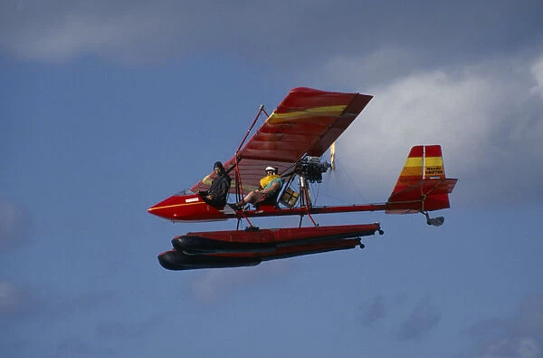 20016492. CUBA Matanzas Province Varadero Two seat microlight airborne carrying a tourist