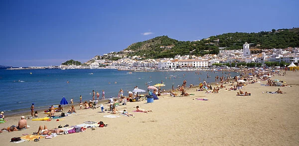 20027603. SPAIN Catalonia El Port de La Selva Curved sandy beach with people sunbathing