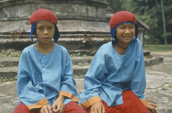 20031668. LAOS Luang Prabang Two boys in traditional dress for new year