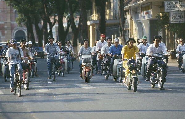 20035007. VIETNAM South Ho Chi Minh City Mopeds and cyclists Saigon