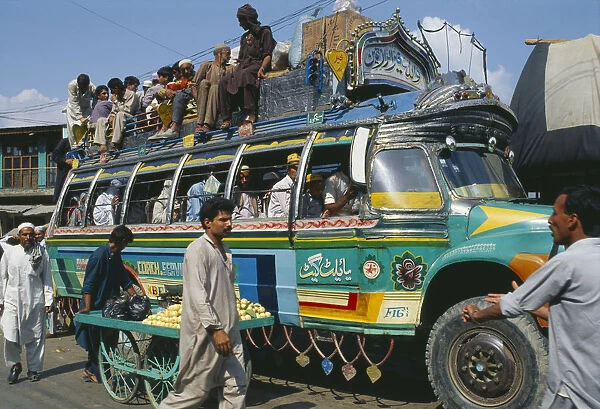 20035460. PAKISTAN Transport Crowded colourful bus in Khwakakhela Swat area. Colorful