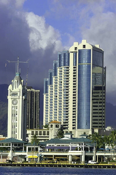 20038548. USA Hawaii Honolulu Aloha Towers hotel seen over water
