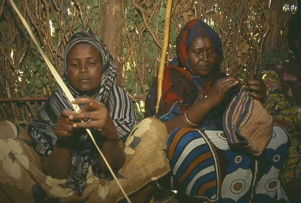 20045992. KENYA Tribal Peoples Local women making clothing