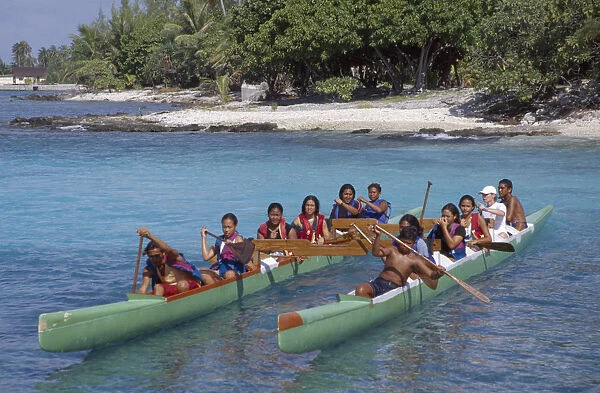 20051314. PACIFIC ISLANDS Tuamotu Islands Ringiroa. Children paddling kayak