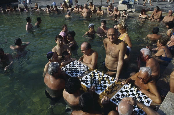 20061612. HUNGARY Budapest Szechenyi Furdo. Chess players in thermal baths of spa