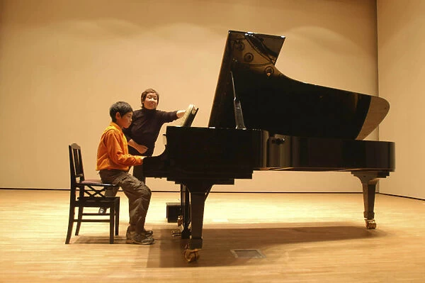 20062866. JAPAN Chiba Tako 11 year old boy named Satoshi Ui plays at a piano recital