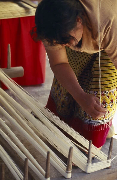 20063645. THAILAND Chiang Mai Mae Jaem Thai woman winding thread in to a skein