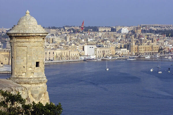20064713. MALTA Vittoriosa View of fortification sentry post overlooking harbour and town