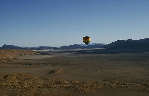 20066175. NAMIBIA Namib Rand Reserve Hot air balloon above Camp Mwisho