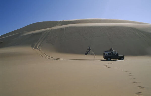 20066178. NAMIBIA Skeleton Coast Terrace Bay Dune driving with jeep on the Roaring Dunes