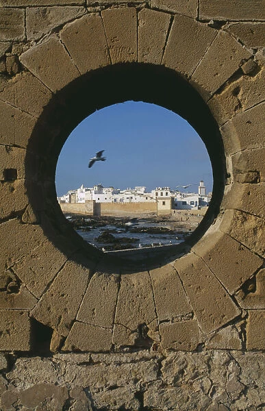20067608. MOROCCO Essaouira Fortified coastal town framed in circular opening in wall