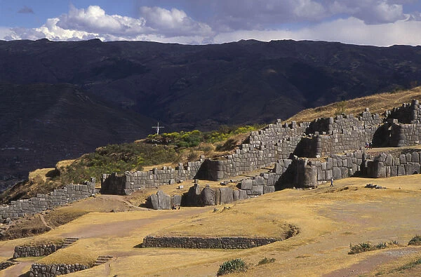 20069053. PERU Cuzco Sacsayhuaman inca site people walking round the old walls
