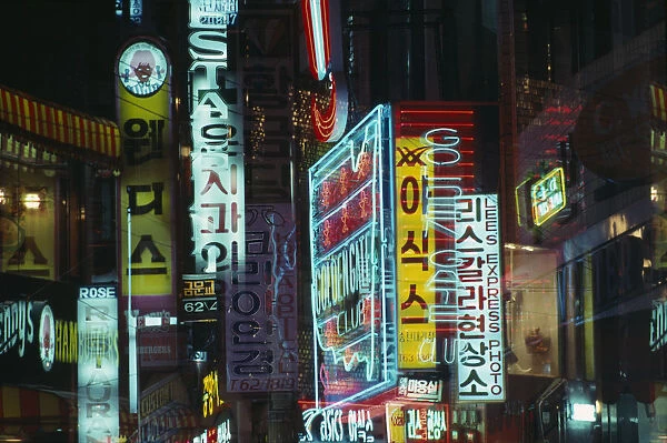 20070169. SOUTH KOREA Songtansi Neon shop signs illuminated at night
