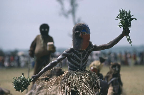 20070551. CONGO Gungu Bapende tribe masked dancer wearing grass skirt