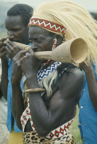 20070920. RWANDA Festivals Tutsi musicians playing horns. Watutsi
