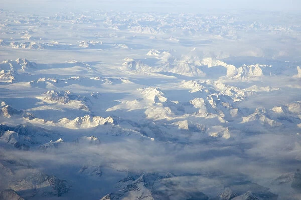 20077311. GREENLAND Landscape Aerial view at sunset including snow covered peaks