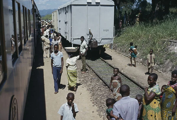 20078722. CONGO Transport Train and passengers at country railway station. Zaire