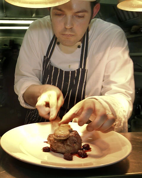 20083184. ENGLAND Bristol Bristol Chef Plating Up Fillet Steak