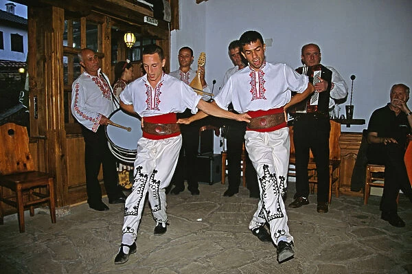 20083940. BULGARIA Arbanassi Male dancers in national costume dancing