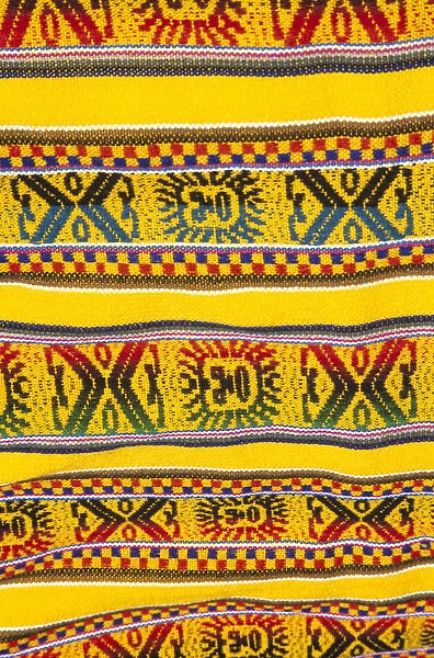 20084025. PERU near Machu Picchu Aguas Calientes Colourful woven blanket in market