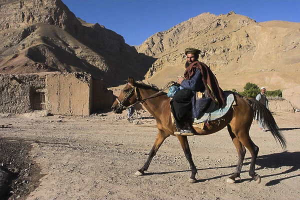 20085370. AFGHANISTAN Ghor Province Pal-Kotal-i-Guk Aimaq man riding horse