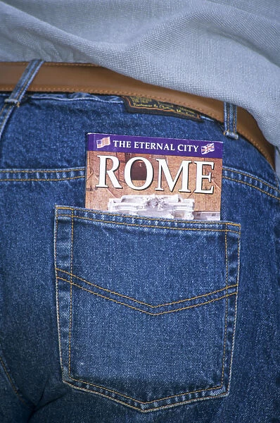 20085778. ITALY Lazio Rome The Eternal City of Rome guide book in tourists pocket