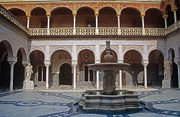 20085879. SPAIN Andalucia Seville House of Pilatos Building and fountain in the courtyard