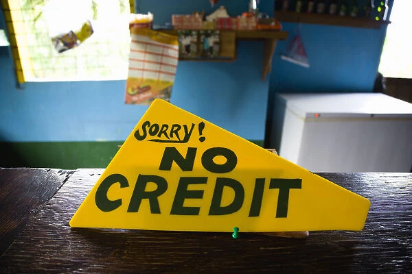 20096223. West Indies Grenada Sign on the counter of a shop that says Sorry No Credit
